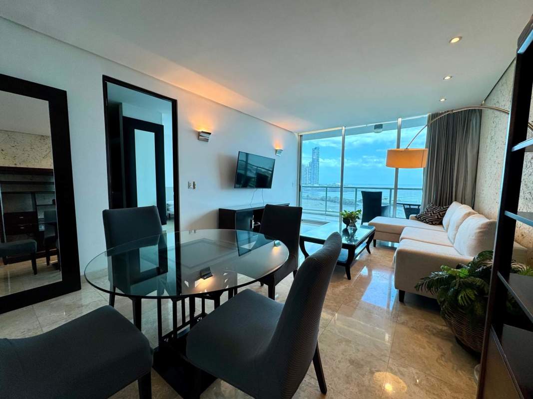 Modern furniture in open living-dining area with sea views at PH Waters on the Bay, Panama City