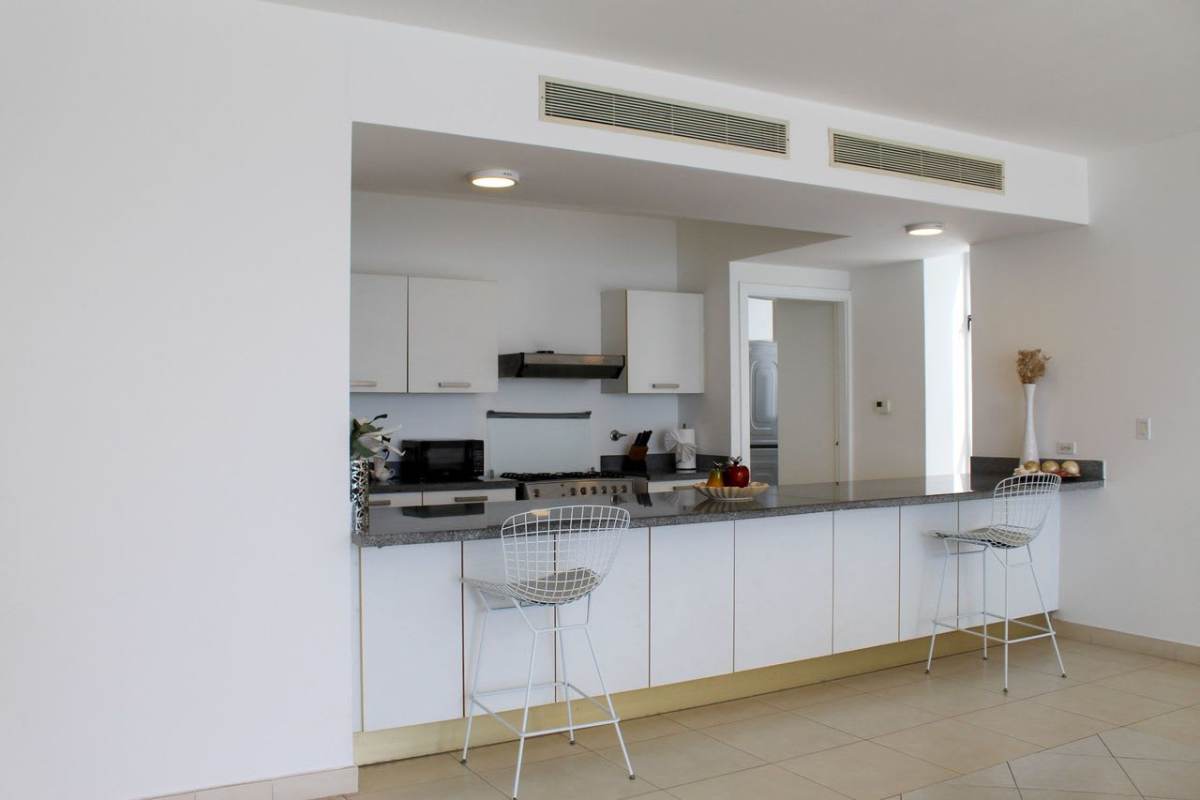 Bedroom with large window ocean view PH Waters on the Bay Avenida Balboa Panama