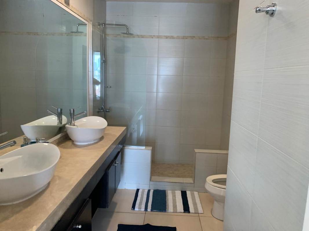 Guest half bathroom with modern sink in PH BICSA rental apartment Panama City