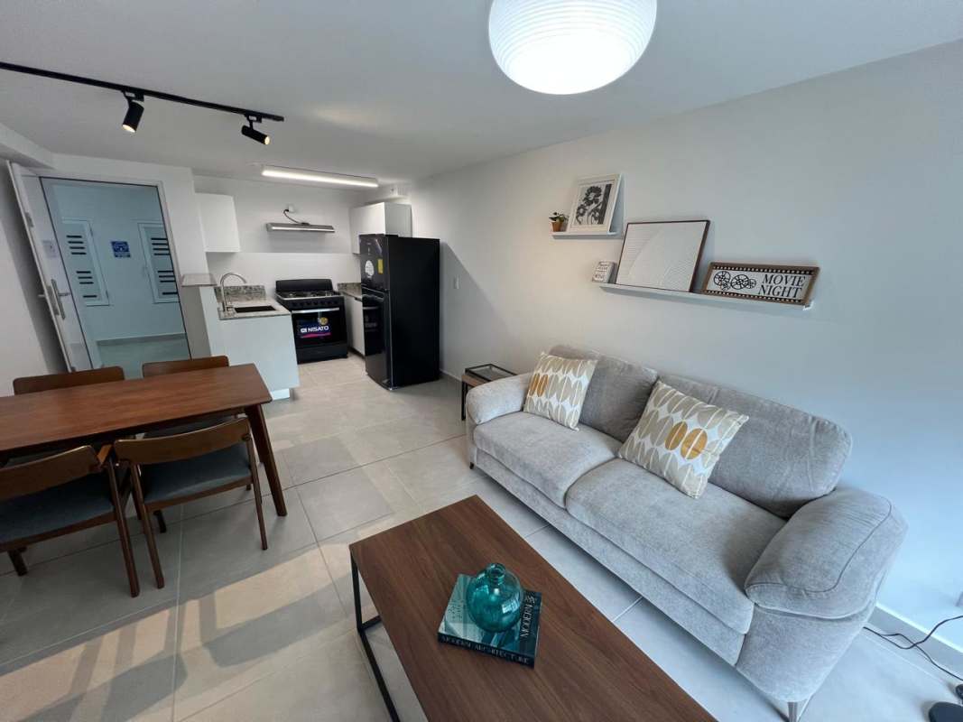 Open living area with integrated kitchen dining space apartment for rent Panama Viejo Residences Chanis