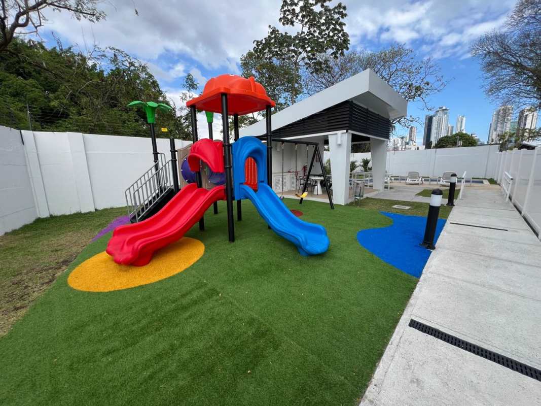 Covered children's playground with swings slides in Panama Viejo Residences Chanis Panama for families