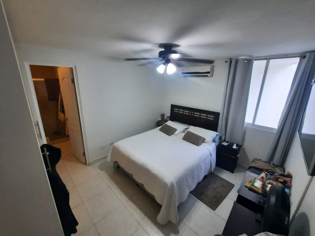 Open living dining space with ceiling fan, balcony access Panama Edison Park