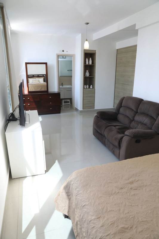 Condo fitness center with cardio, strength machines, bright windows PH San Francisco Bay Panama