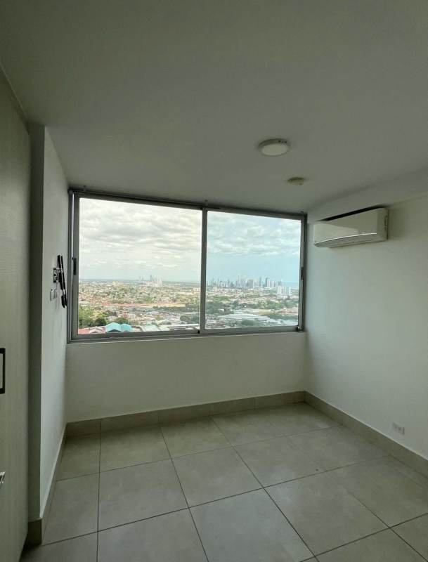 Bedroom with panoramic skyline view in PH Sky Point rental Panama City