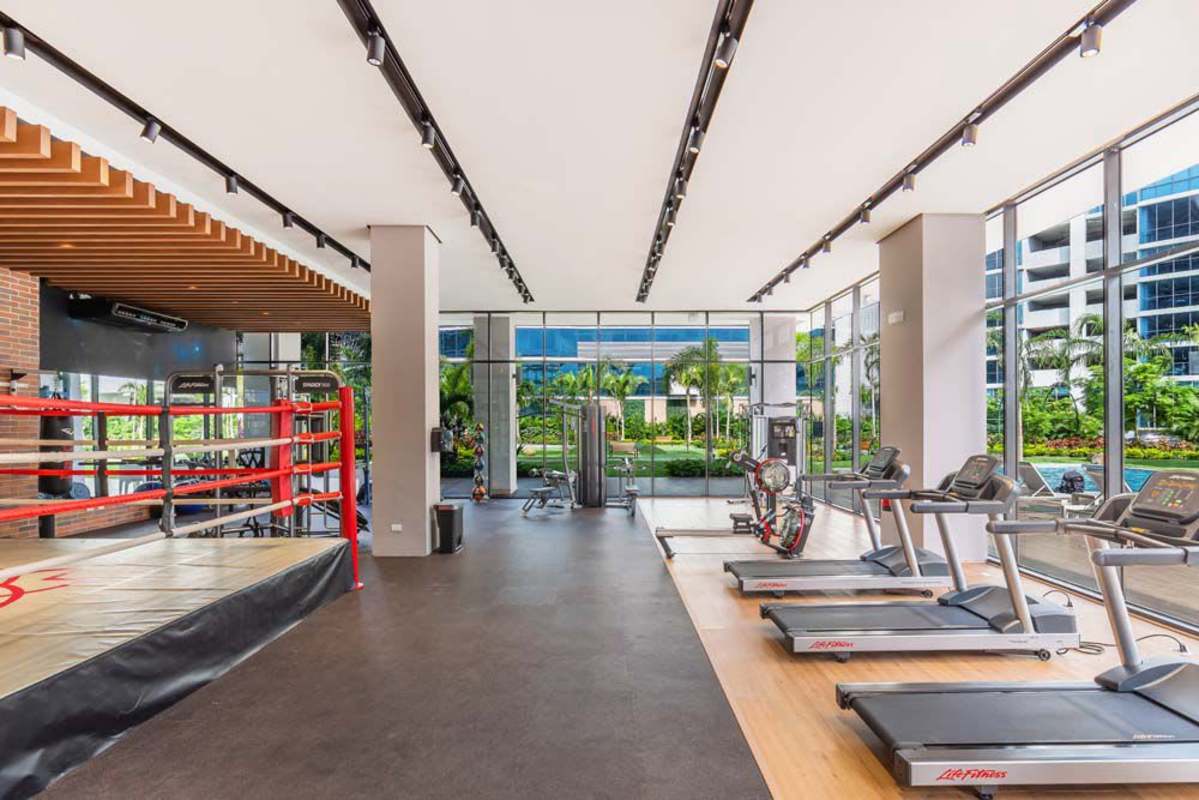 Luxury condominium gym with boxing ring, cardio zone and views of gardens Costa del Este Panama