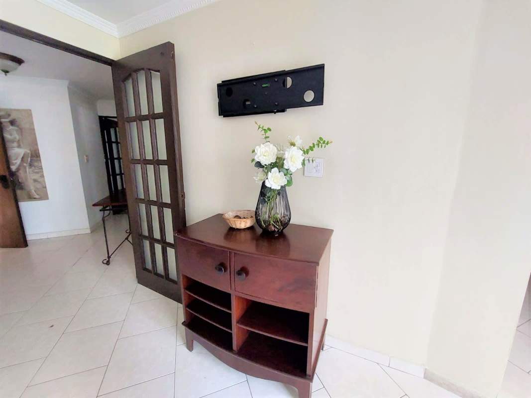 Entry hallway with dark wood console, decorative basket, flowers PH Coral Plaza Marbella Panama