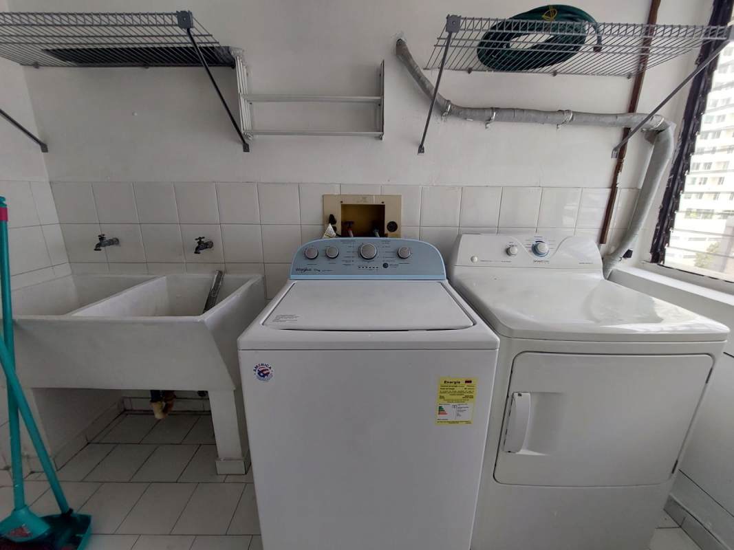 Laundry room with washer, dryer, utility sink, tiled walls PH Coral Plaza Marbella Panama