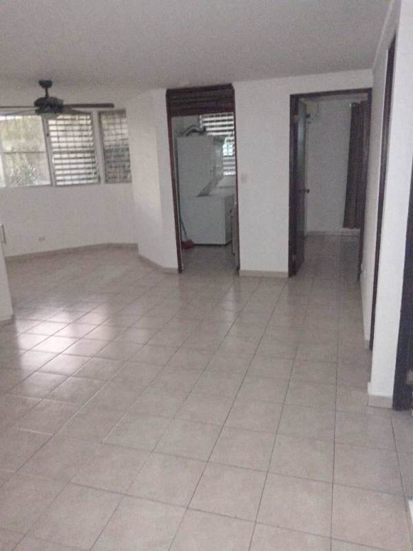 Open space living dining area with tiled floors, ceiling fan and large windows in apartment for rent near Costa del Este