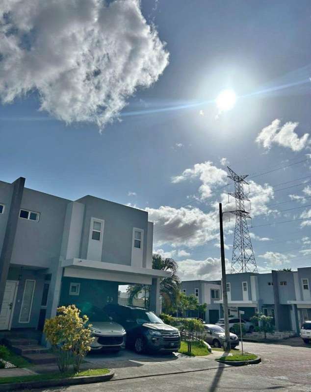 Bathroom with glass-enclosed shower, pedestal sink, skylight in PH Augusta Brisas del Golf Panama
