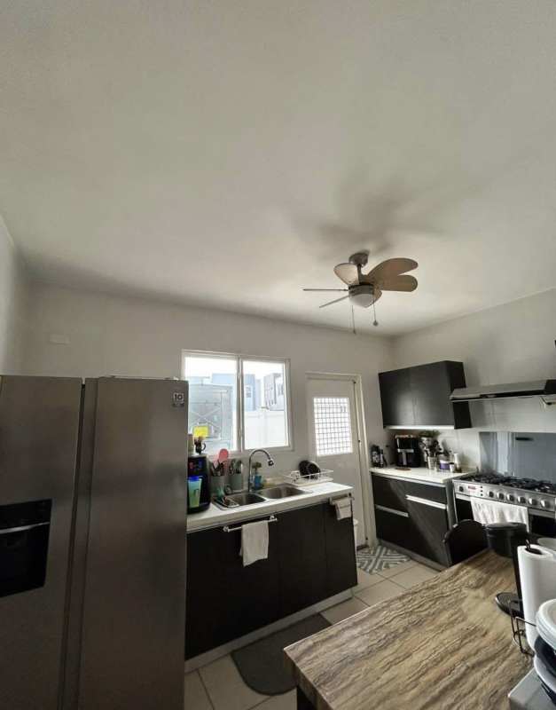 Outdoor swimming pool area with lounge chairs in PH Augusta Brisas del Golf Panama