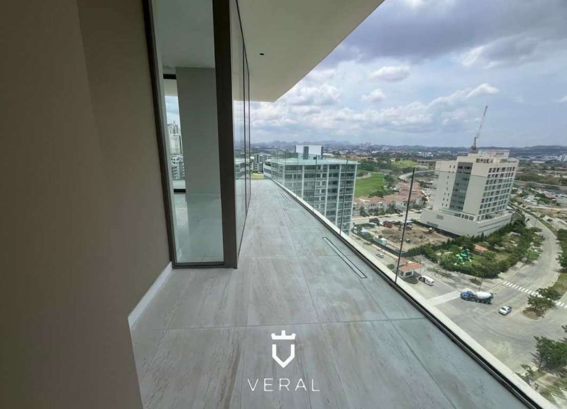 Luxury double-height lobby with curved staircase, panoramic windows, marble floors at La Maison by Fendi Santa María