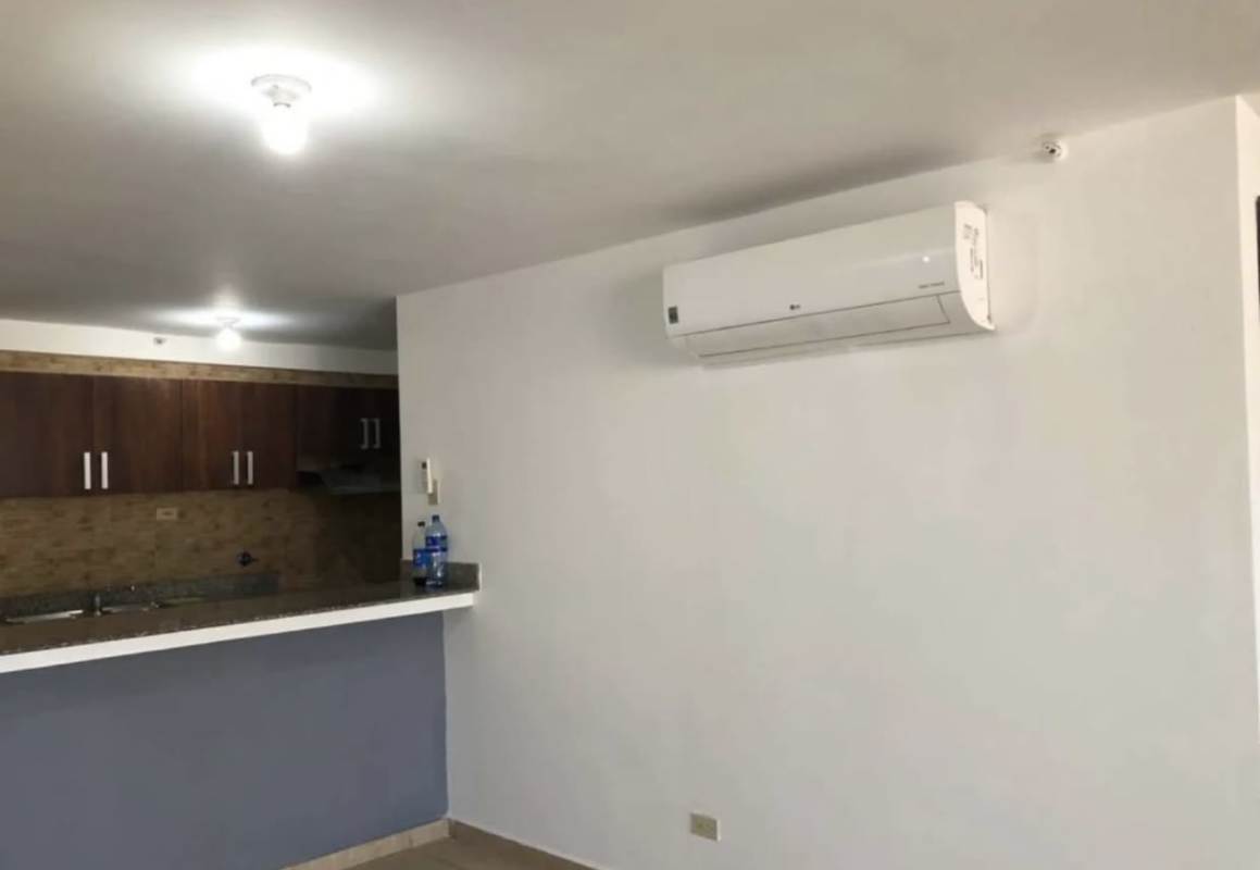 Spacious living room with large sliding doors to balcony, porcelain tile floors in PH Terrazas del Rey Condado del Rey Panama City