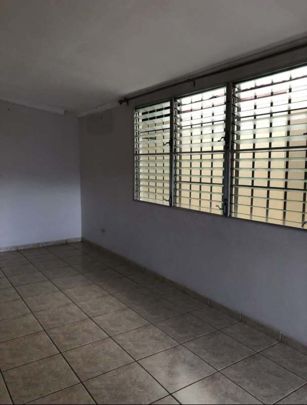 Spacious living room with tiled floors, large metal louver windows in Terrazas de Brisas del Golf Panama City