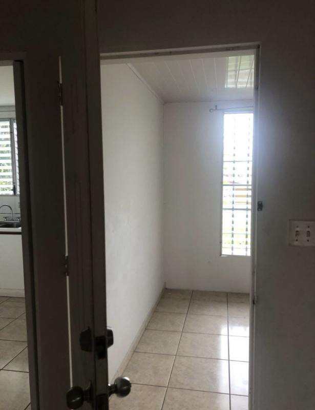 Utility room with vertical barred window, white walls in Terrazas de Brisas del Golf Panama