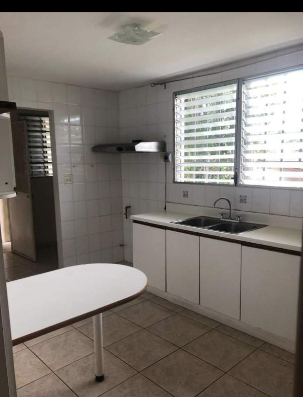 Functional kitchen with double sink, white tiled walls, natural light Terrazas de Brisas del Golf Panama