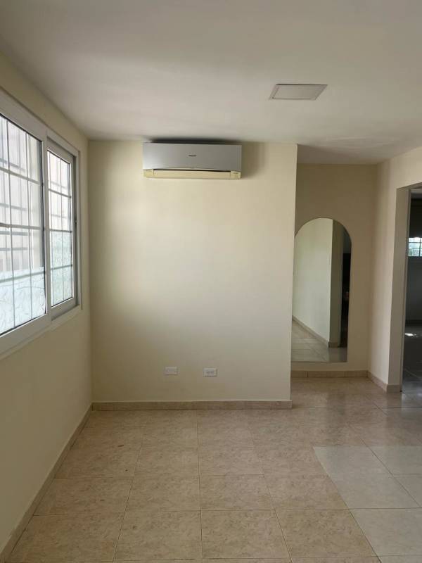 Large tiled living space with split AC and multiple windows duplex home for sale Brisas del Golf Panama