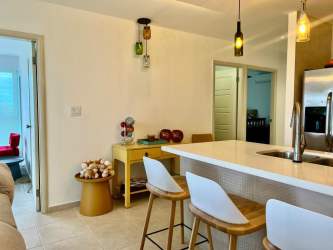 Furnished modern living room with access to balcony and ocean views in PH Coronado Bay Nueva Gorgona Panama