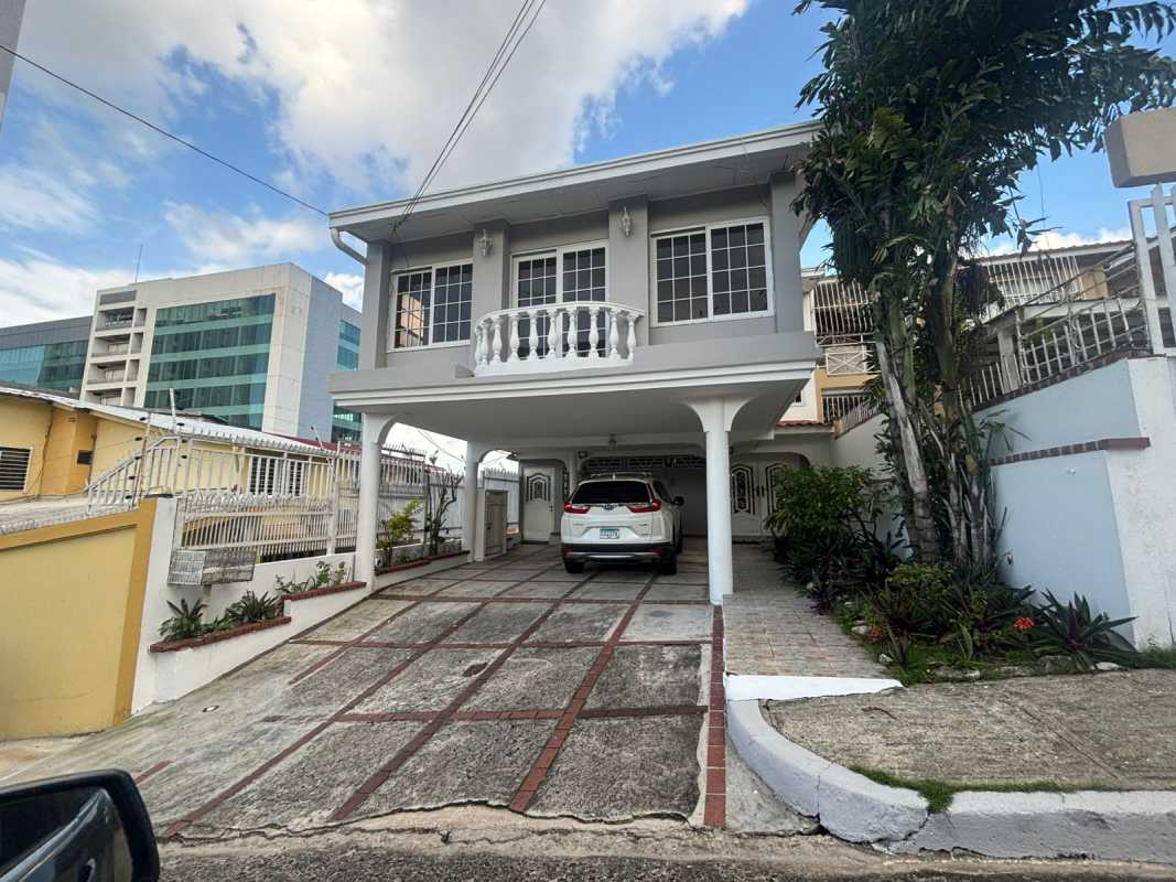 Bright living room with tiled floors, crown molding, and balcony access in Club X Betania Panama