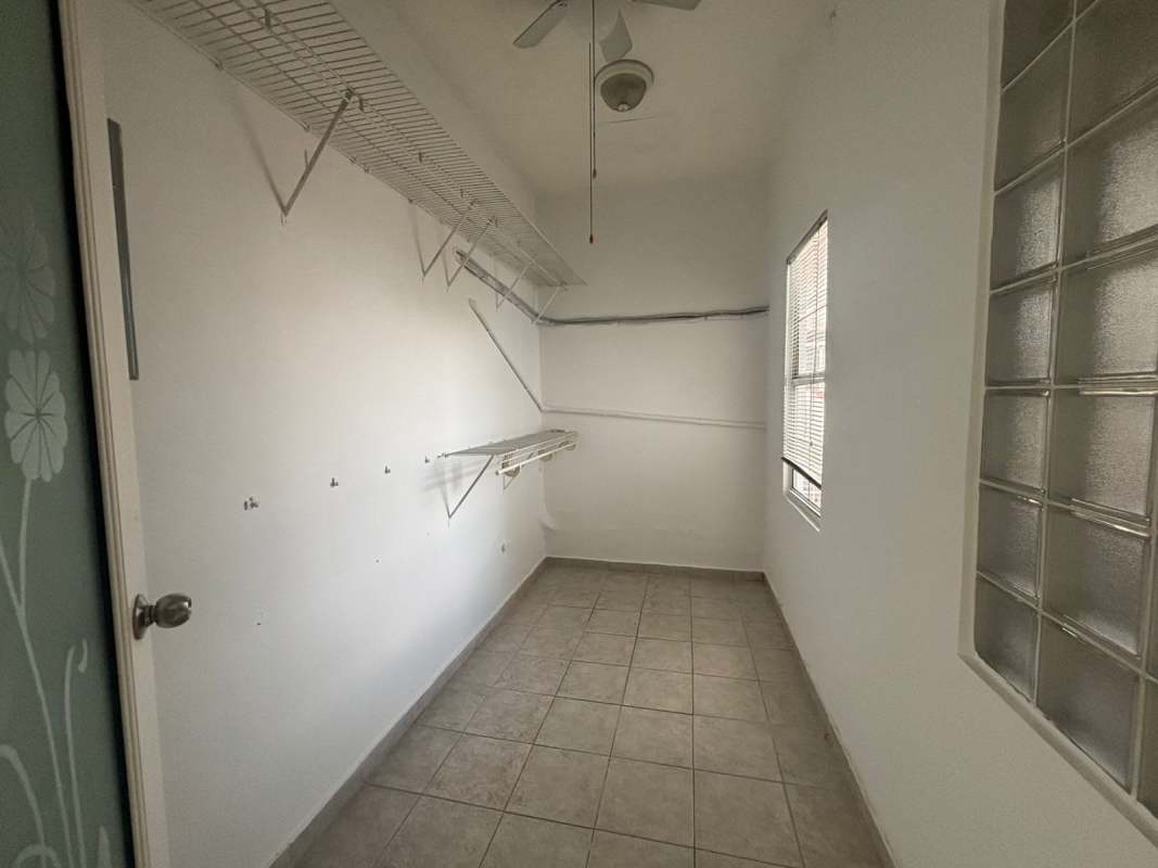 Covered terrace with tiled floors and garden view in Club X Betania Panama