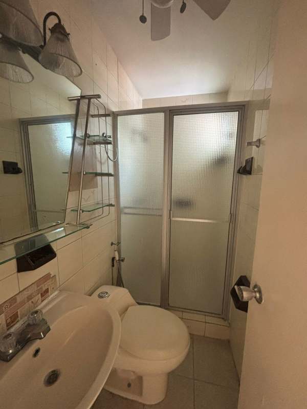 Traditional kitchen with granite countertops, wooden cabinets, gas stove in Club X Betania Panama