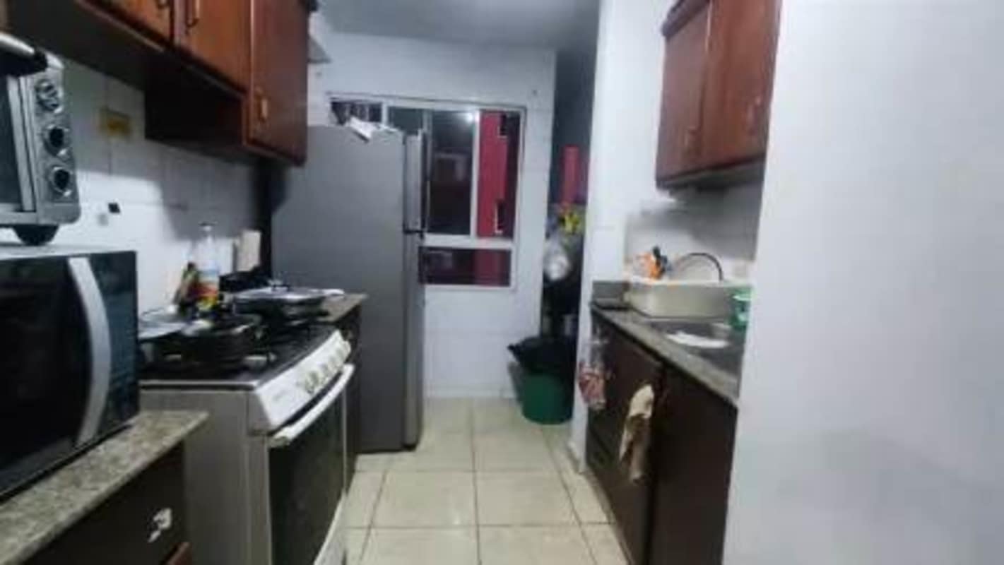 Fully equipped traditional kitchen with granite countertops and wooden cabinets Villa de las Fuentes Panama