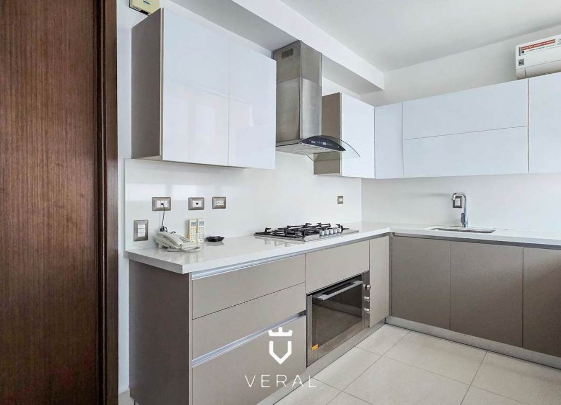 Contemporary kitchen with built-in appliances, marble countertop in PH Bali Costa del Este Panama