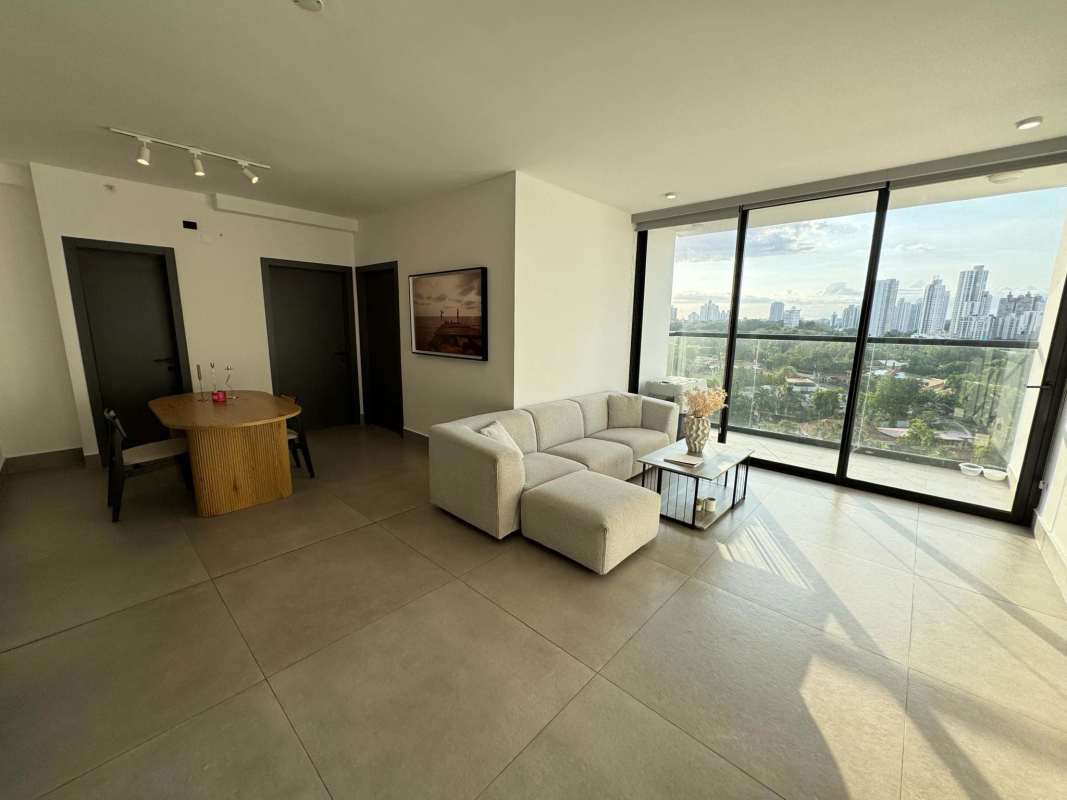 Modern living dining room with large windows panoramic city skyline view Coco del Mar Panama