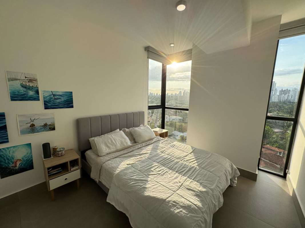 Bedroom with large windows panoramic city skyline light Coco del Mar Panama