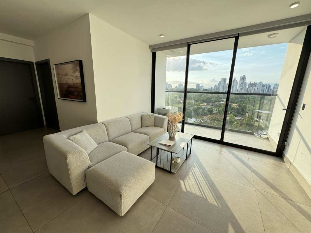 Bright living dining room with large windows city ocean views Victory Sport Tower Panama