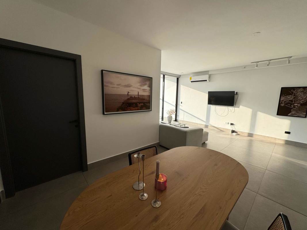 Bedroom with corner windows panoramic views ocean city skyline sunset Coco del Mar