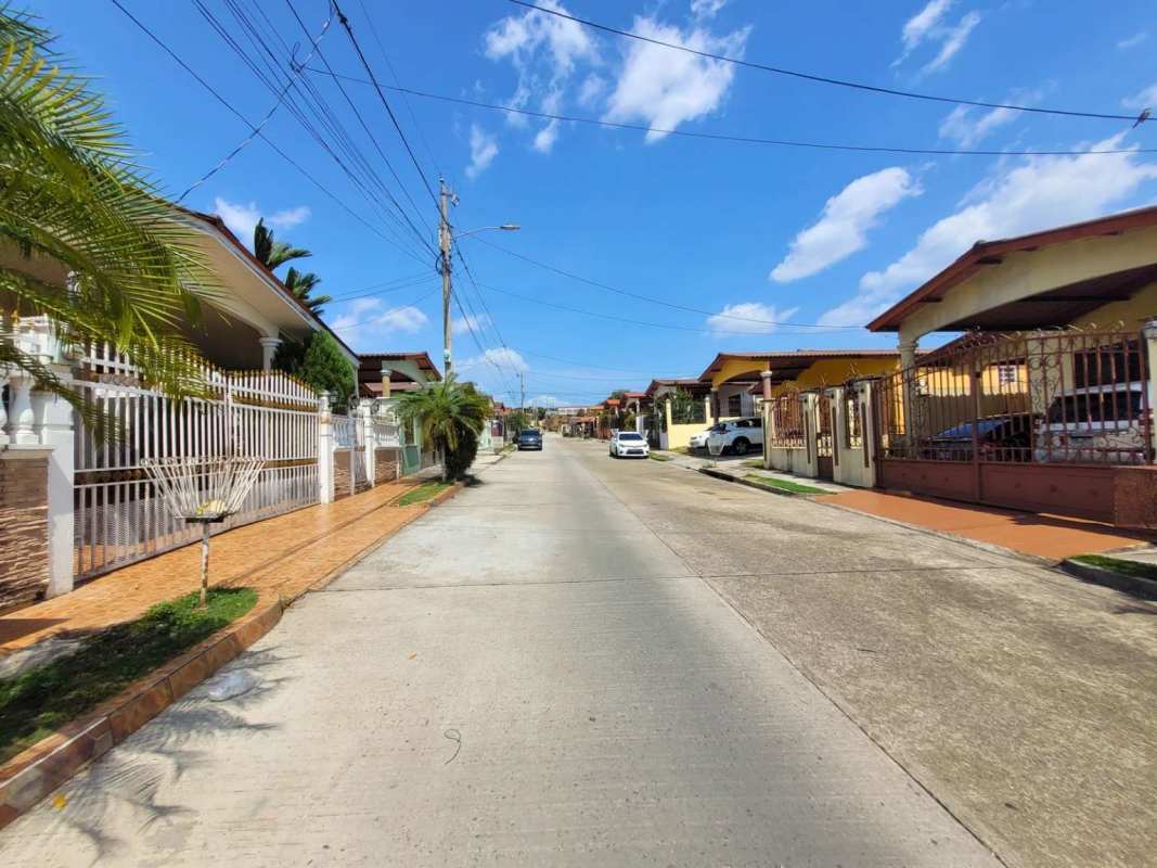Gated community single-story homes street view Brisas del Golf Panama