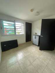 Bathroom with pedestal sink, walk-in shower, ceramic tiles in Oropendolas home Arraijan