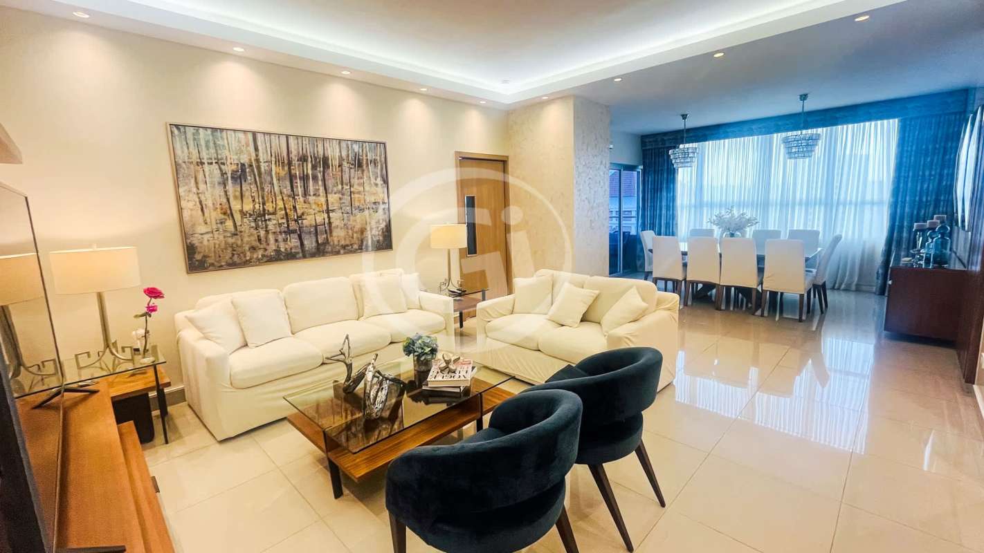 Open plan living and dining with large windows and balcony at PH South Coast San Francisco Panama