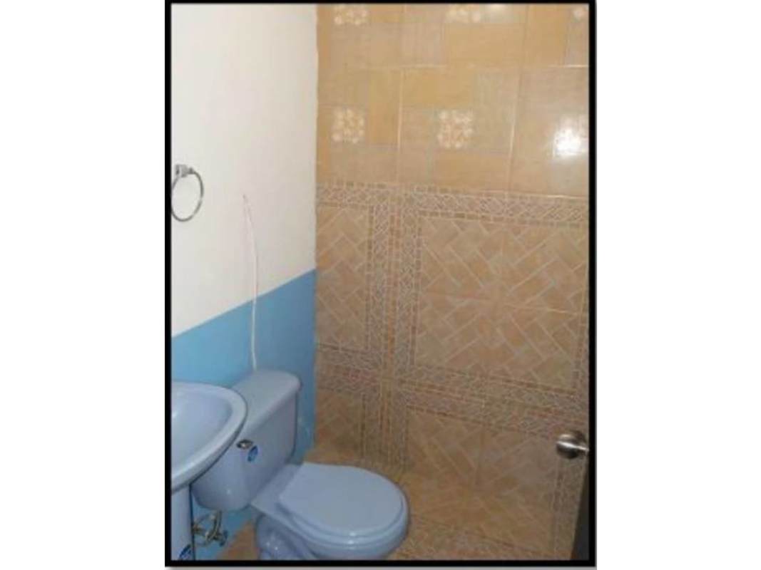 Bathroom with ceramic tiles toilet and enclosed shower in Altos de la Castellana house