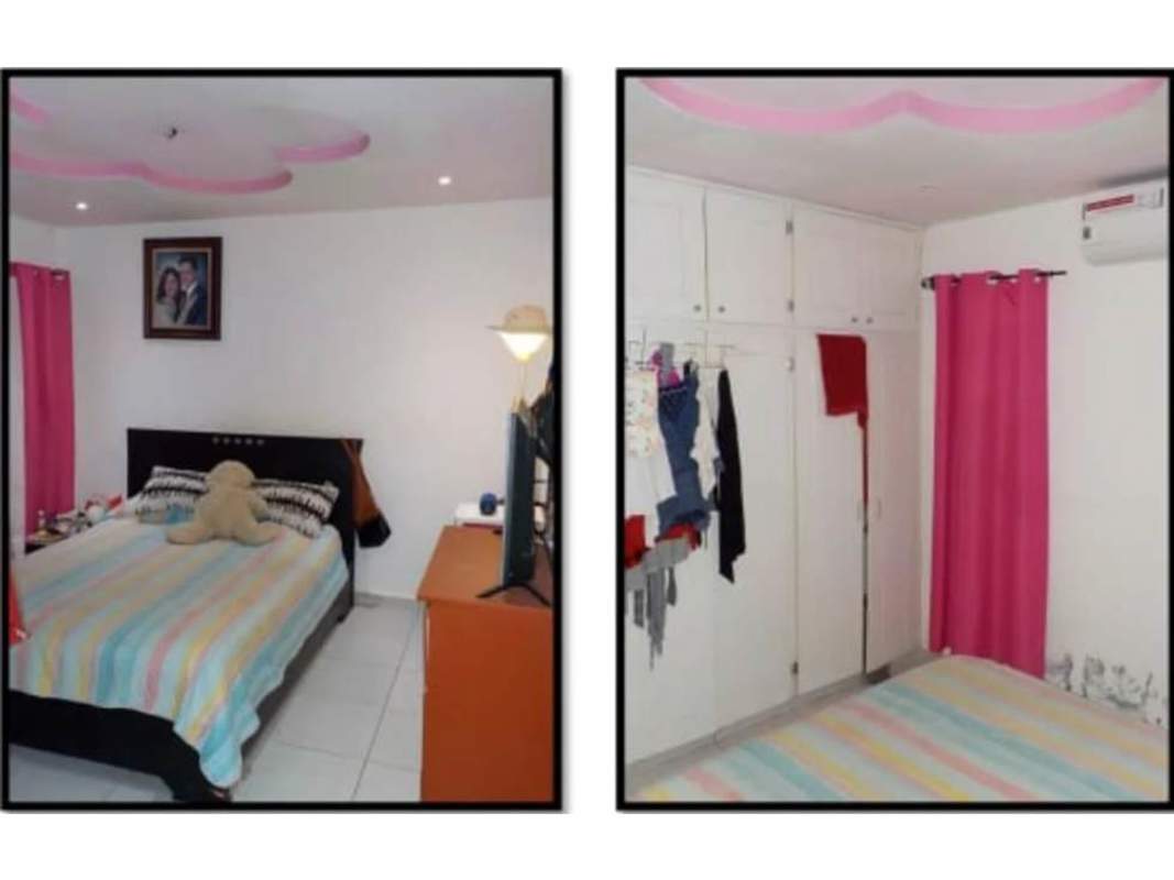 Bedroom with closet pink curtains tile floor in Altos de la Castellana home