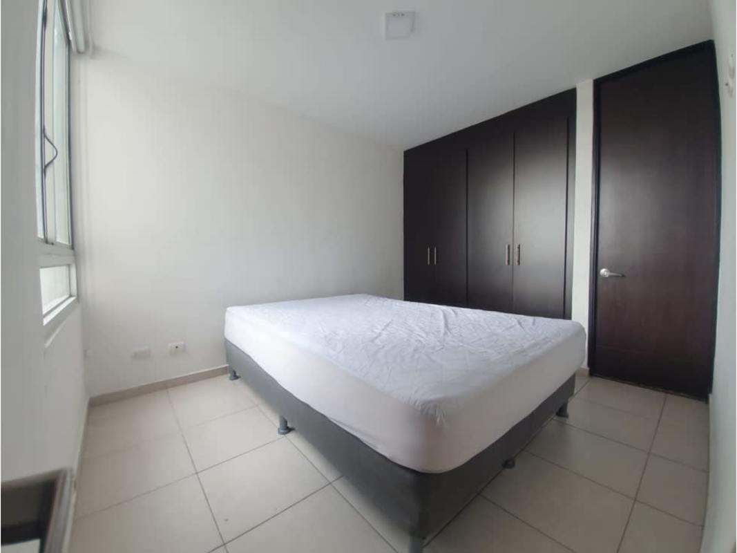 Minimalistic bedroom design, built-in closet, large window, tile flooring in PH Alsacia Tower Panama
