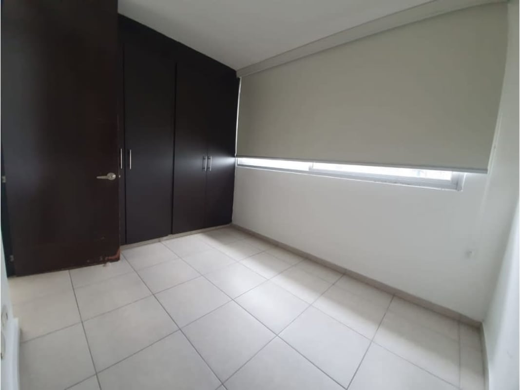 Bedroom with built-in wardrobe, window, tile flooring in PH Alsacia Tower apartment rental Tumba Muerto Panama