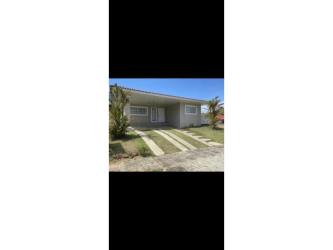 Single story house front with carport and lawn at Villas del Maria Chame Panama