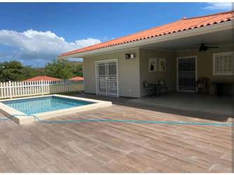Open kitchen with island and living area Villas del Maria Chame