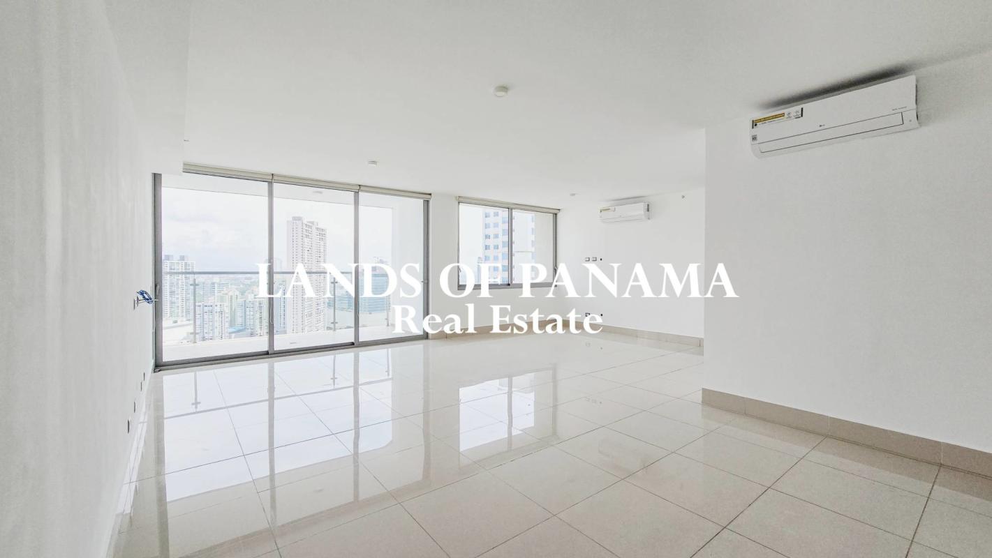 Large open living room with porcelain floors and balcony access at PH Bali Costa del Este apartment