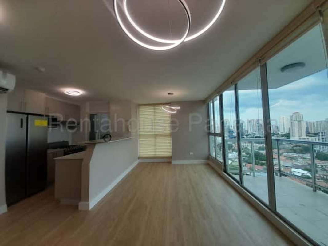 Contemporary kitchen with white cabinets and built-in appliances in PH Oasis Panama City