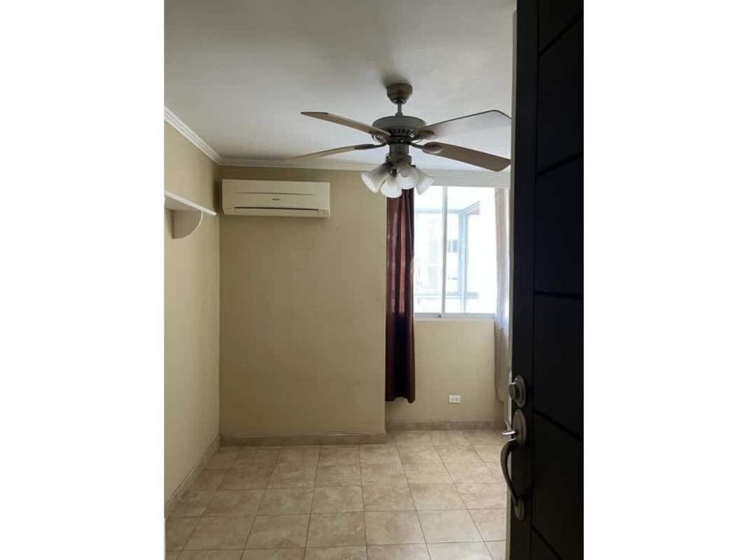 Bedroom with ceiling fan, AC unit, tile flooring and window PH Cosmopolitan Tower Panama