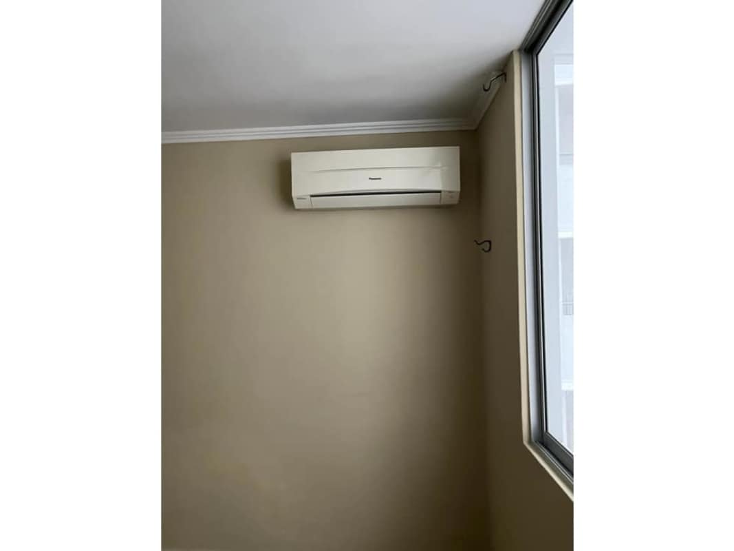 Empty bedroom with AC, tiled floor and window at PH Cosmopolitan Tower Panama