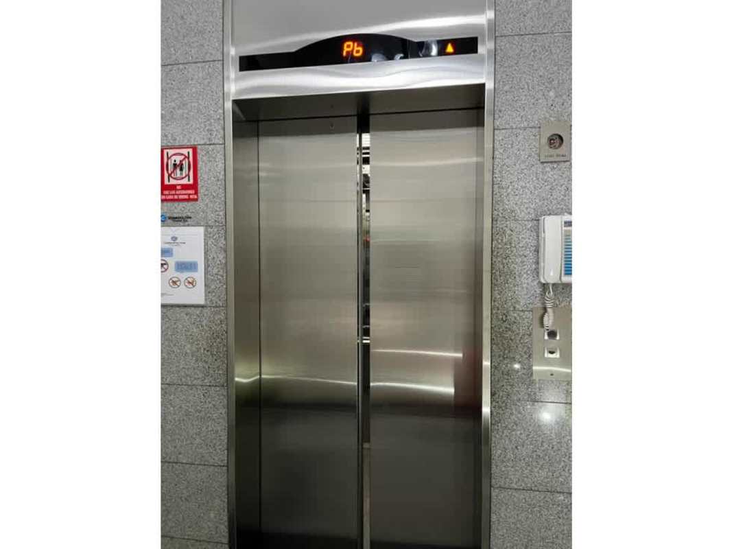 Modern elevator with stainless steel doors in lobby PH Cosmopolitan Tower Panama