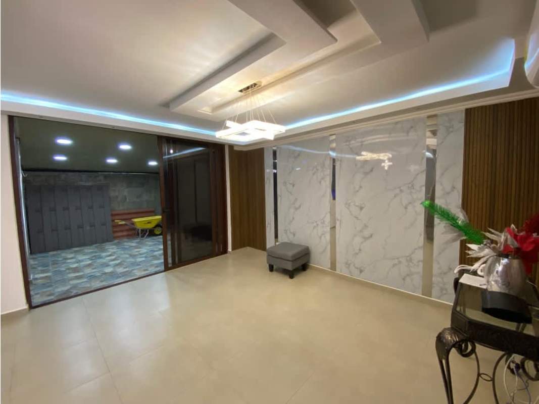 Bright living room marble accent wall recessed lighting PH Gardenias Brisas del Golf Panama