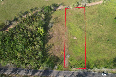 Large titled land parcel with green fields and road access Punta Mala Pedasi Panama