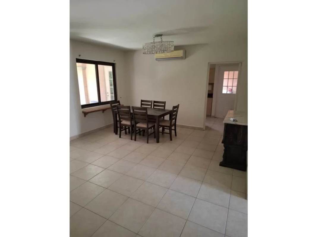 Dining area with natural light, modern furniture and AC, Panama City house