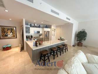 Modern kitchen with granite counters, stainless appliances, decorative accents in Buenaventura Panama condo