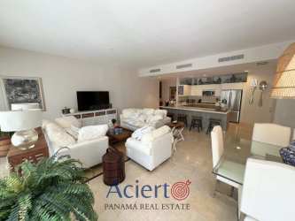 Master bedroom with large closet, blue accents, modern furnishings Buenaventura beach apartment Panama
