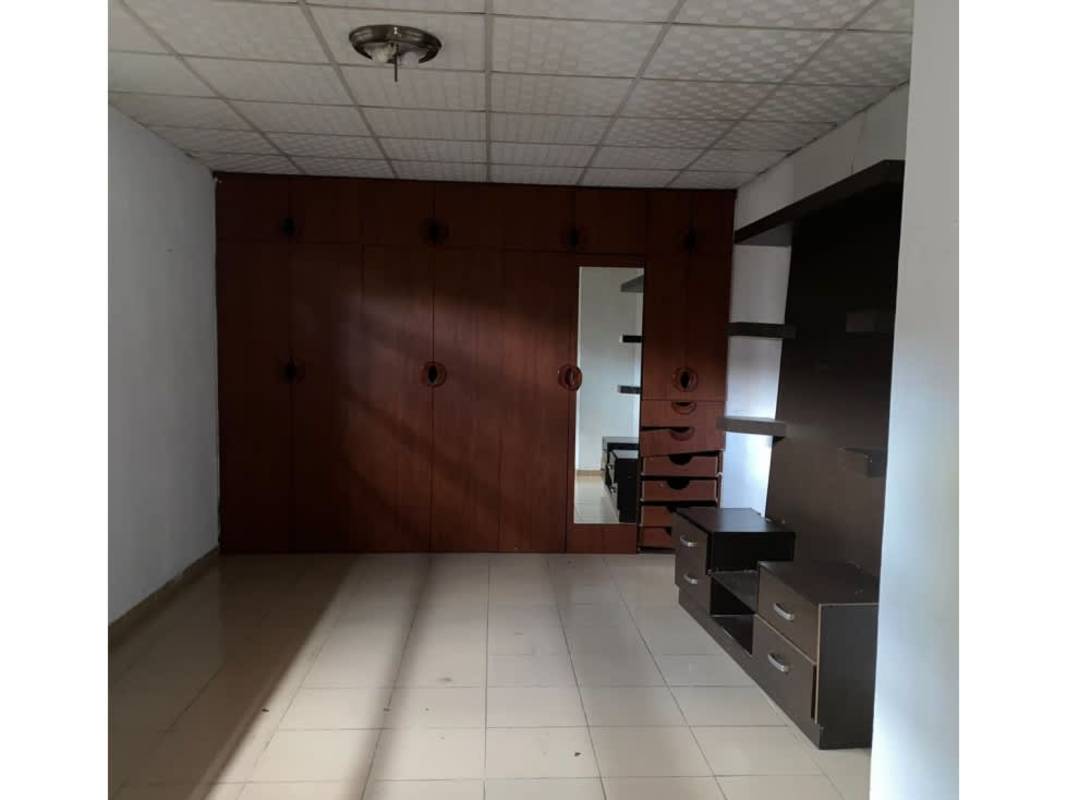 Traditional kitchen granite countertop, green backsplash, wood cabinets in rental house El Crisol